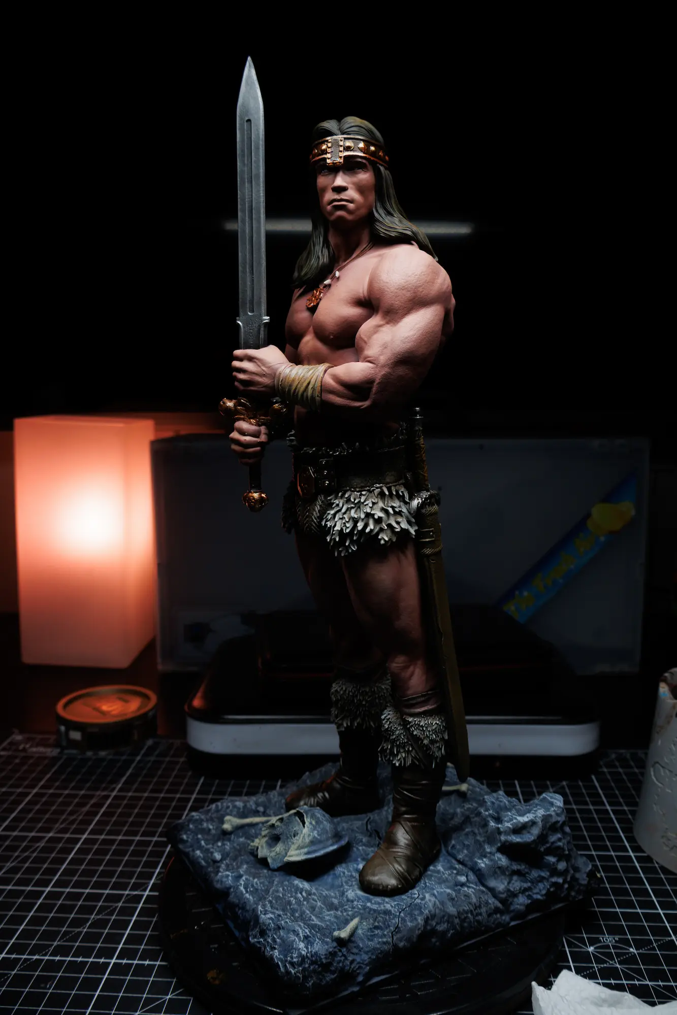 Painted resin miniature of Conan the Barbarian with drybrushed metallic steel and stone base.
